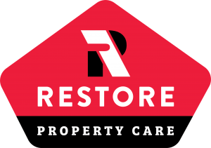 restore property care logo. red, black, and white colors are used